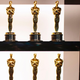 Eight Oscar statues, all of which are going in the trash